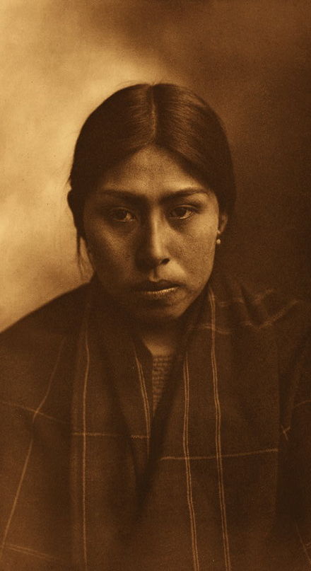 Suquamish woman photographed by Edward S. Curtis in 1913.