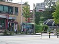 Entrance sign, Store and Bus stop