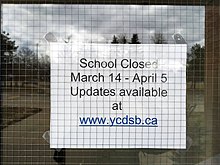 Notice of school closure at a YCDSB high school in Markham, shortly after the pandemic began in 2020. Note the stated reopening date in what was initially expected to be a brief lockdown. Father Michael McGivney Catholic Academy sign during COVID-19 shutdown.jpg