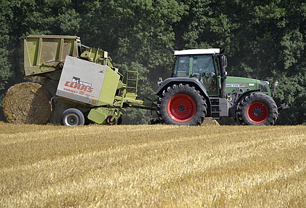 This is an appropriate image for illustrating images for agricultural articles or the like. It shows a Fendt-tractor with a hay baler in use.