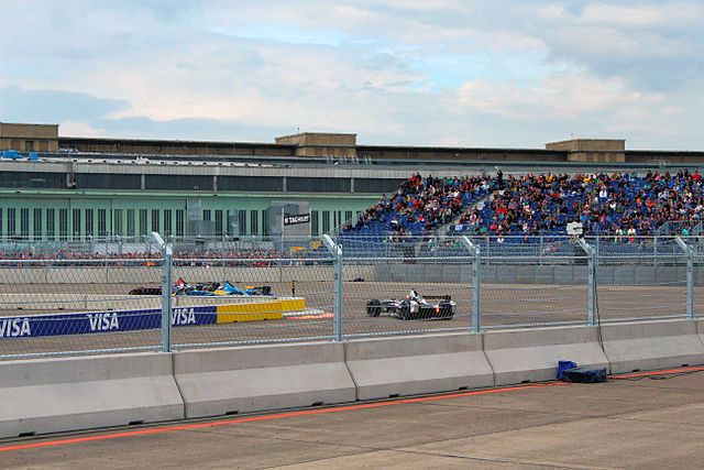 Cars pass through turn ten.