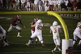 Gilbert drops back for a pass in the BCS National Championship game. Gilbert BCS Game.jpg