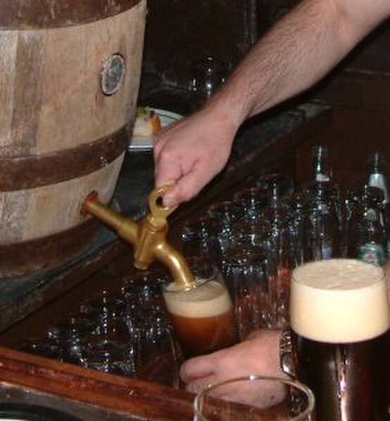 Schlenkerla Rauchbier, a traditional smoked beer, being poured from a cask into a beer glass
