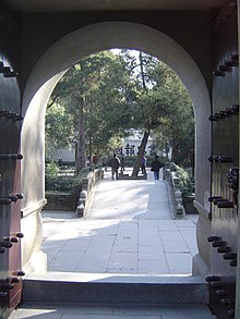 Inside the grounds of Yue Fei's tomb and shrine in Hangzhou; the inscriptions at the far end read Serve the country with the utmost loyalty.