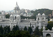 A white building with multiple domes