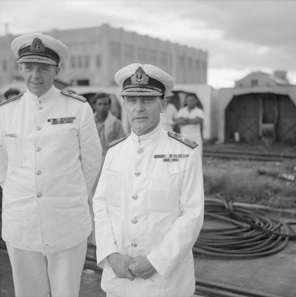 Admiral Sir Tom Phillips (right), commander of Force Z, and his deputy, Rear Admiral Arthur Palliser, on the quayside at Singapore naval base, 2 Decem