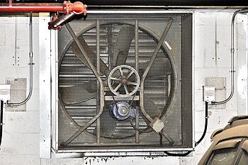 An axial belt-drive exhaust fan serving an underground car park. This exhaust fan's operation is interlocked with the concentration of contaminants emitted by internal combustion engines. Industrial Exhaust Fan.jpg