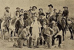 Original caption to 1917 image in The Moving Picture Weekly reads, "Jack Ford (kneeling at left) with his company." John ("Jack") Ford kneeling (left) with his film company's cast, 1917.jpeg