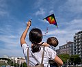 Image 568Jules and Gabriel flying a kite at Alameda Afonso Henriques, Lisbon, Portugal