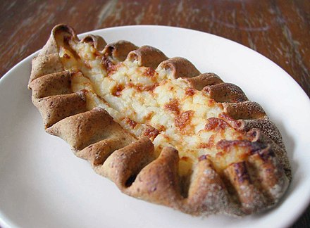 Karelian pasty (karjalanpiirakka)  is a traditional Finnish dish made from a thin rye crust with a filling of barley, or rice. Butter, often mixed with boiled egg (egg butter or munavoi), is spread over the hot pastries before eating.