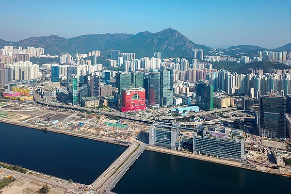 A panoramic view of Kowloon Bay reclamation (left) and Ngau Tau Kok (right) across from it. The old Kai Tak Airport runway is on the left.