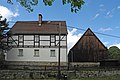 Residential stable house (No. 26), house for migrants (No. 25) and barn of a three-sided courtyard