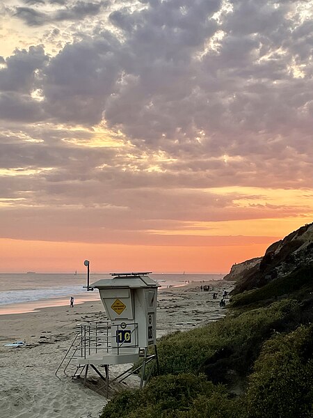 File:Life guard station at beach during sunset.jpg