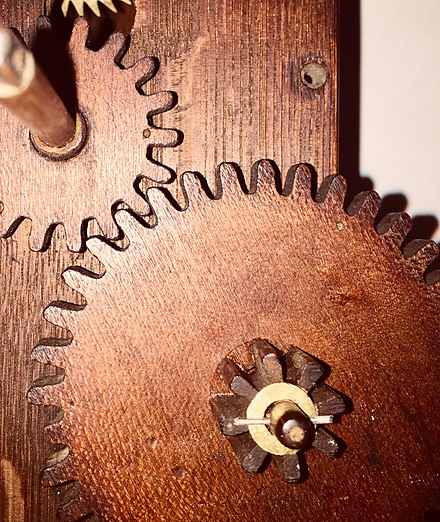 Milled gear teeth on a Terry style wooden movement clock.