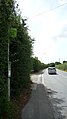 English: The bus stop in Newport Road, Northwood, Isle of Wight. It is named "Chawton Lane", after the side road it is situated next to. This is the Newport-bound side, served by route 1. This stop used to be served by Southern Vectis route 28 (previously number 30), but Southern Vectis gave this up, and the old 28 number had been covered over with an orange sticker. Wightbus took over the 28 (running it as route 30 again), but this was withdrawn in September 2010.