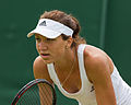 Patricia Maria Țig competing in the first round of the 2015 Wimbledon Qualifying Tournament at the Bank of England Sports Grounds in Roehampton, England. The winners of three rounds of competition qualify for the main draw of Wimbledon the following week.