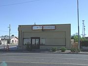 The T and T Market building was built in 1939 and is located at 2145 East Van Buren Avenue. This property is recognized as historic by the Asian American Historic Property Survey.