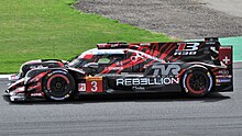 Menezes driving in the 2018 6 Hours of Silverstone. Rebellion R13 Menezes Silverstone 2018.jpg