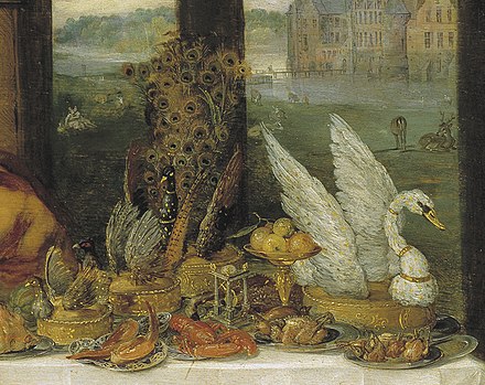 A detail of a painting by Jan Brueghel the Elder (1568–1625) and Peter Paul Rubens (1577–1640) depicting several bird pies. Cooked birds were frequently placed by European royal cooks on top of a large pie to identify its contents.[1]