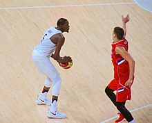Nikola Jokic with Kevin Durant in the group stage game United States Rio 2016 - Men's basketball USA-SRB (29168433900).jpg