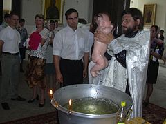 Baptism by submersion in the Eastern Orthodox Church (Sophia Cathedral, 2005) Russian-baptism.JPG