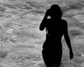 Silhouette of Bikini-Clad Woman in Water.png