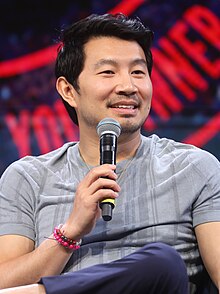Simu Liu speaking at the San Diego Comic-Con International in 2019