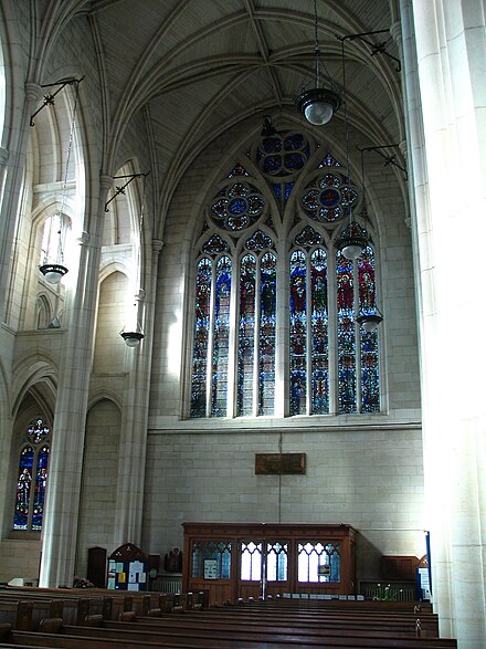Interior view looking at the Memorial Window above the front entrance which reads "This Window was Erected To the Glory of God and in thankful and loving remembrance of those of Otago and Southland who gave their lives in The Great War 1914-1918" St. Paul's Cathedral, Dunedin, NZ, Memorial Window.JPG