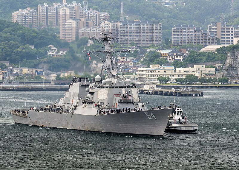 File:Starboard bow view of USS Curtis Wilbur (DDG-54) assisted by tug while departing Yokosuka 180517-N-GH917-0001.jpg