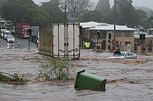 Flash flooding caused by heavy rain falling in a short amount of time. Trapped woman on a car roof during flash flooding in Toowoomba 2.jpg