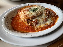 Lasagna with Parmesan cheese at the top.
