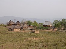 Village huts near Iliomar on the Iliomar-Uatu kerbau road, Lautem, 8 Apr 2003.jpg