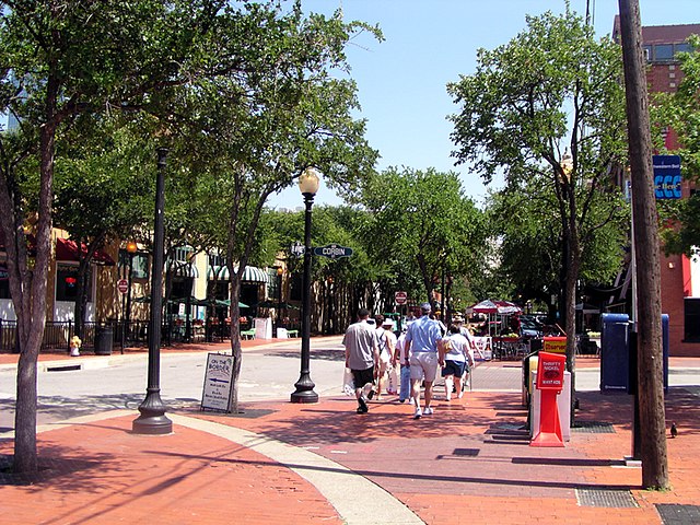 Tourists in the West End stroll down Market Street