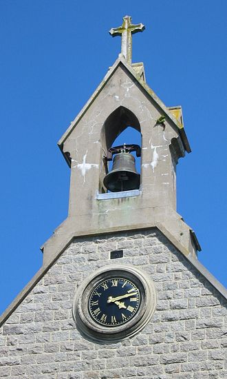 View of belltower Eglyise Catholique d'Not' Danme d'l'Annonchiation et des Martyrs du Japon, Saint Martin, Jerri 2.jpg