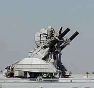 an Orthros CIWS; armed with twin 20 mm guns and 2 octo-racks of MVI-66.
