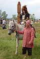 Якутская невеста в традиционном одеянии верхом на лошади