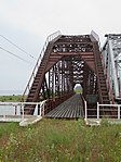 Однопролётный металлический мост на каменных опорах, 123.54 саж.
