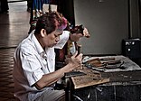 File: A traditional craftman and his craft (8574912886).jpg