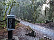Aptos Creek steel bridge in the middle of the Forest of Nisene Marks State Park, with pay phone