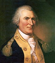 A white-haired man wearing a navy jacket with gold lapels and epaulets and a high-collared white shirt