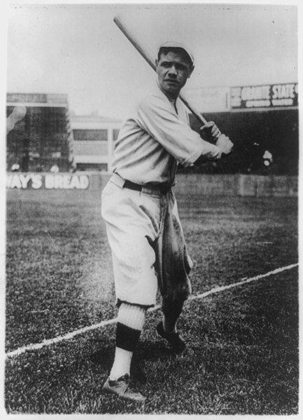 File:Babe Ruth, full-length portrait, standing, facing front, holding up bat, in baseball uniform, on field LCCN89714713.jpg