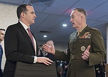 Marine Corps Gen. Joseph F. Dunford, Jr., chairman of the Joint Chiefs of Staff, speaks to special envoy for the Global Coalition to Counter the Islamic State of Iraq and the Levant, Brett H. McGurk, during the 2017 Chiefs of Defense Conference at Fort Belvoir, Va., Oct 24, 2017 Brett McGurk and Joseph Dunford 171024-D-PB383-001 (26167954559).jpg