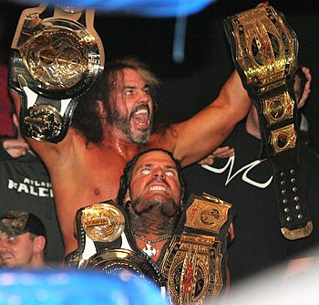 ...two OMEGA Tag Team Championships (left), and two TNA World Tag Team Championships (right)