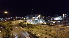 Night works lifting in the prefabricated final (and biggest) Canada Street span over State Highway 1. Canada Street Bridge Lift Almost Finished.jpg