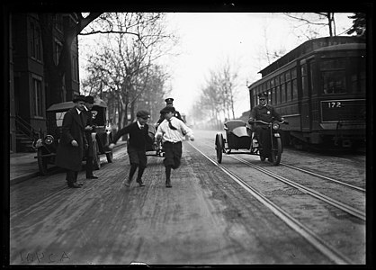 Children, the police and a streetcar around 1922