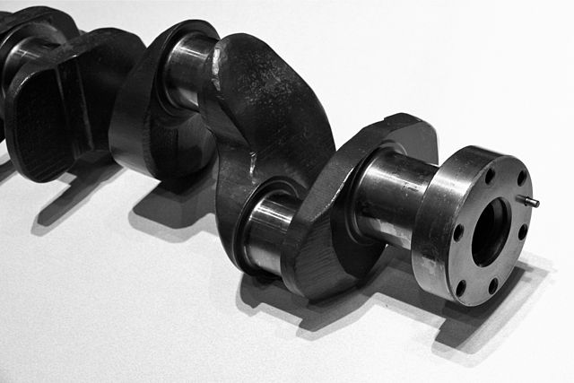 Flying arm (the boomerang-shaped link between first and second crankpins) on a crankshaft)