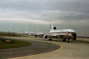 Line-up of Delta aircraft, led by a Lockheed 1...