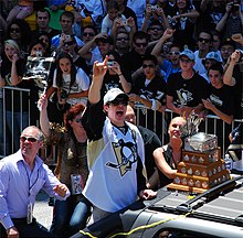 Malkin, along with his parents (left), during the Penguins' victory parade for their 2009 Stanley Cup victory.