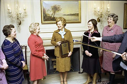 The National Woman's Party presents Ford with a plaque honoring her as its inaugural “Alice Paul Award” in the White House’s Map Room on January 11, 1977 (the 92nd birthday of Alice Paul)[124]