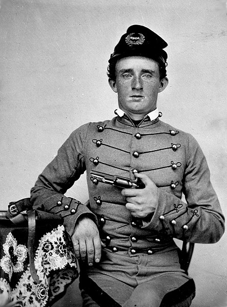 USMA Cadet George Armstrong "Autie" Custer, ca. 1859 with a Colt Model 1855 Sidehammer Pocket Revolver.